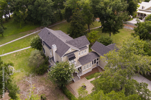 Low aerial view of beautiful residential home on large  property.