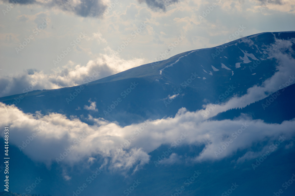 Fog on a mountain range in the Carpathian mountains Fog on a mountain range in the Carpathian mountains
