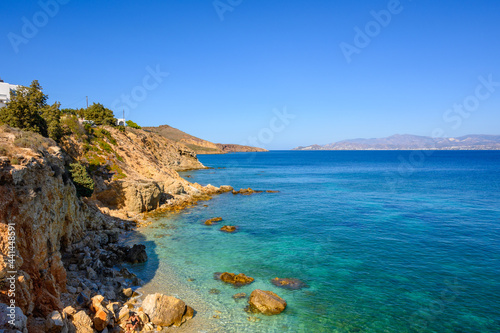 Rocky cliffs on the coast of Piso Livadi. Beautiful bay overlooking the island of Naxos. Paros, Greece