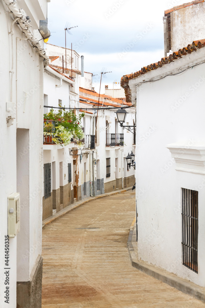 Cobbled street and houses in the town of Aroche, Huelva, Spain 