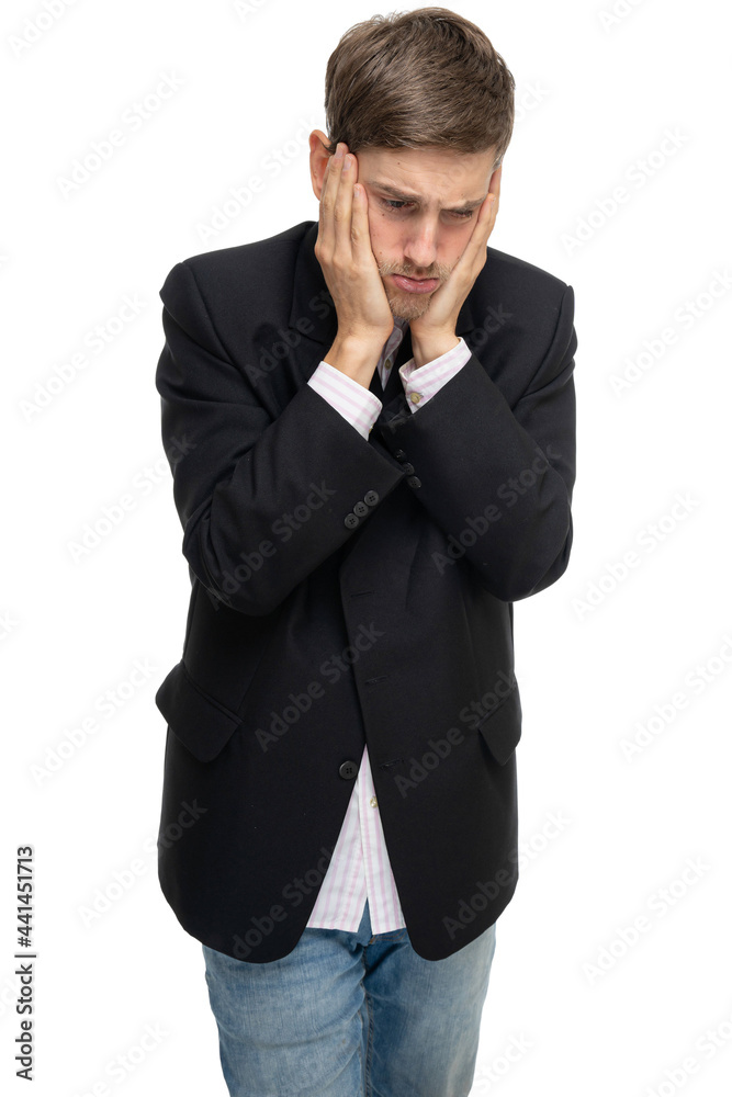 Young handsome tall slim white man with brown hair is sad in black blazer isolated on white background Young handsome tall slim white man with brown hair is sad in black blazer isolated on white background