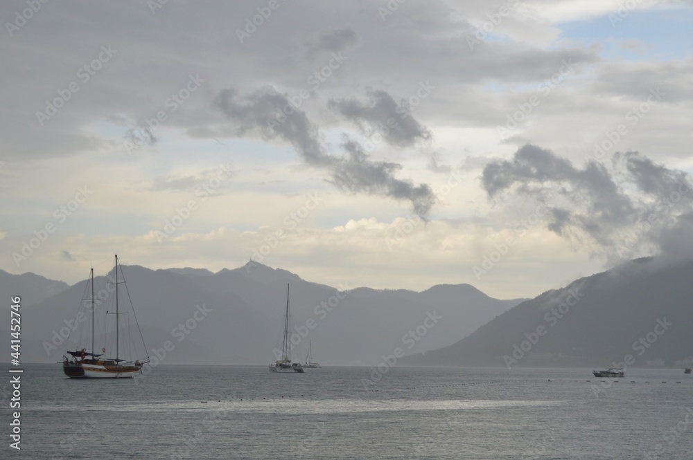 Marmaris, Turkey. Seascape of Aegean Bay Sea with yachts in raining day.