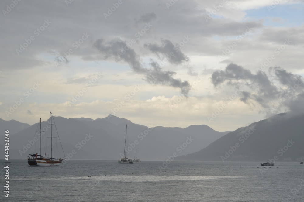 Marmaris, Turkey. Seascape of Aegean Bay Sea with yachts in raining day. Marmaris, Turkey. Seascape of Aegean Bay Sea with yachts in raining day.