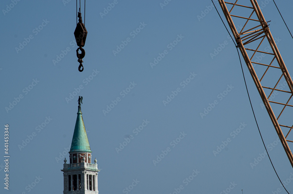 venice dayly construction woks with the hook on a bell tower venice dayly construction woks with the hook on a bell tower
