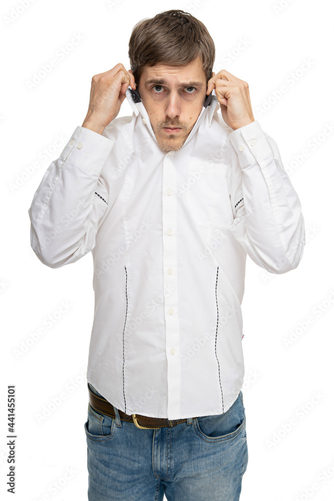 Young handsome tall slim white man with brown hair pulling his collar in white shirt isolated on white background Young handsome tall slim white man with brown hair pulling his collar in white shirt isolated on white background