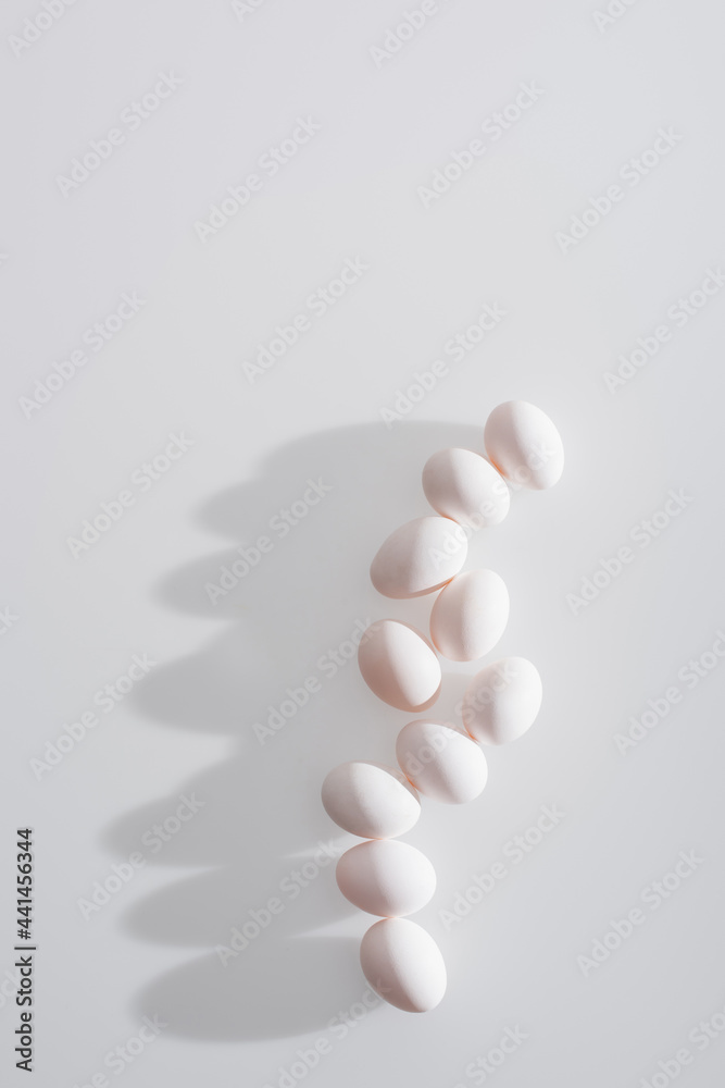 top view of fresh and organic eggs in shell on white background top view of fresh and organic eggs in shell on white background