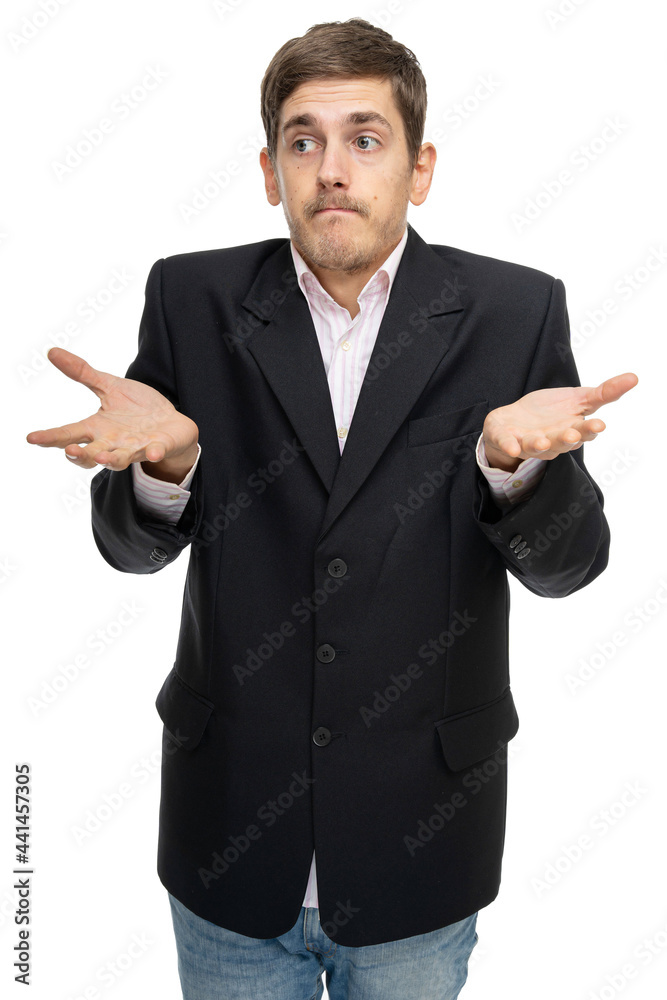 Young handsome tall slim white man with brown hair looks unsure in black blazer in blue jeans isolated on white background Young handsome tall slim white man with brown hair looks unsure in black blazer in blue jeans isolated on white background