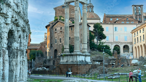 Photography the ancient wall of the Colosseum and the majestic columns of the Temple of the