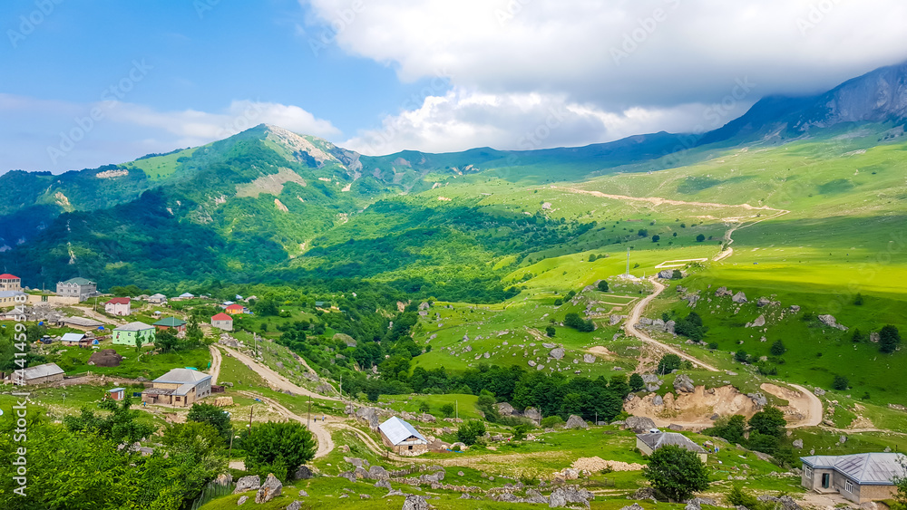 Colorful summer in the mountains of Azerbaijan. Village and road in the Quba district