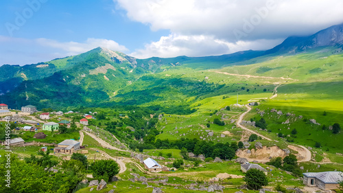 Fototapeta Naklejka Na Ścianę i Meble -  Colorful summer in the mountains of Azerbaijan. Village and road in the Quba district