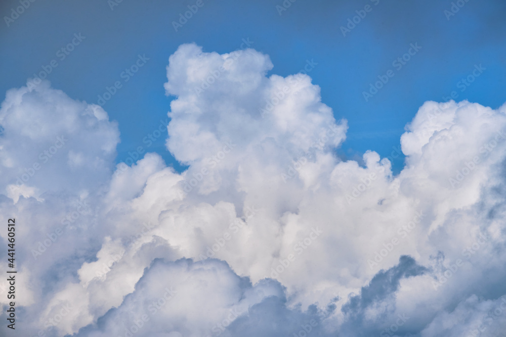 Lift your head up and you will see beauty of sky. Thick white clouds in bright blue sky. Minimalistic background for ad text or desktop screensaver. Lift your head up and you will see beauty of sky. Thick white clouds in bright blue sky. Minimalistic background for ad text or desktop screensaver.
