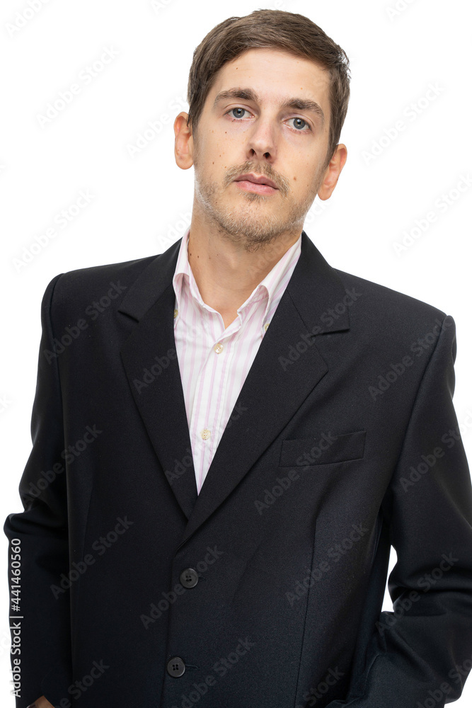 Young handsome tall slim white man with brown hair looks haughty in black blazer isolated on white background Young handsome tall slim white man with brown hair looks haughty in black blazer isolated on white background