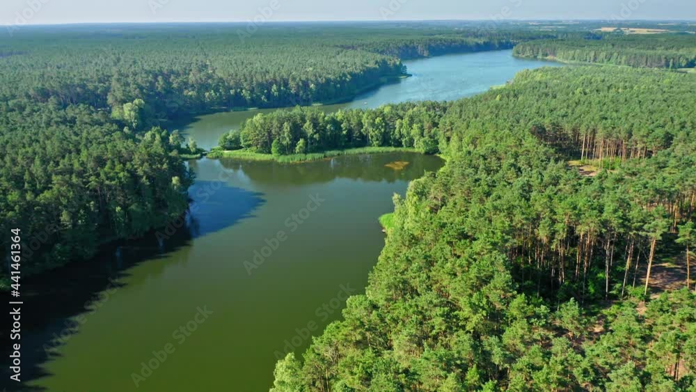 Lake and forest in spring. Aerial view of nature, Poland. Lake and forest in spring. Aerial view of nature, Poland.
