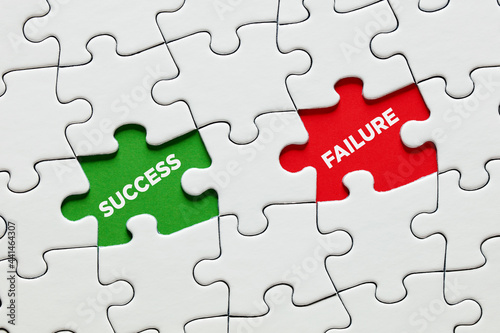 Missing puzzle pieces with the words success versus failure. To succeed or fail in education, business or career