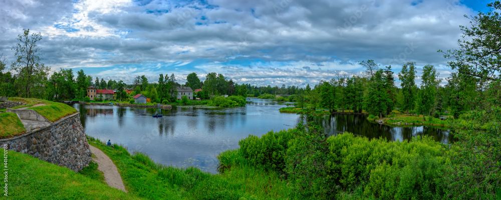Panorama of the banks of sleepy Vuoksa River at sunny summer day. Priozersk, Russia. Panorama of the banks of sleepy Vuoksa River at sunny summer day. Priozersk, Russia.
