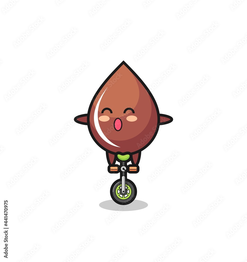 The cute chocolate drop character is riding a circus bike The cute chocolate drop character is riding a circus bike