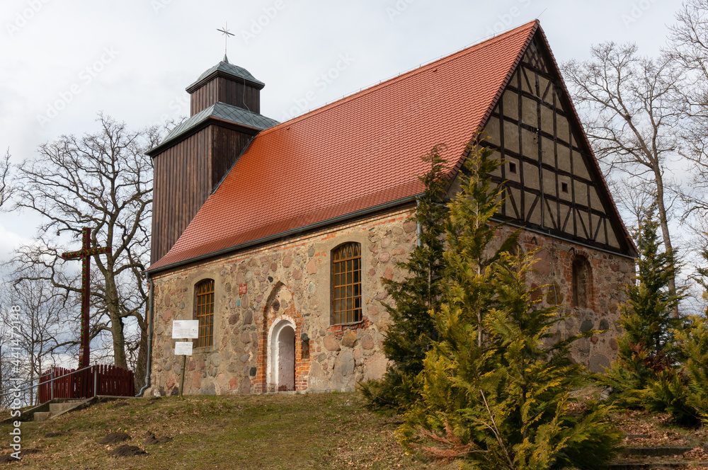 Church of the Assumption of the Blessed Virgin Mary (Kościół Wniebowzięcia Najświętszej Maryi Panny) from the 16th century. Wooden tower, 18th century. Chwarstno (village in Lobez County), Poland.