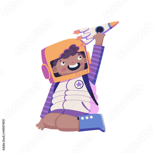 Boy in a spacesuit playing with a rocket vector illustration