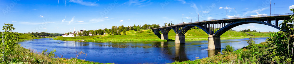 Arch bridge over the river on sunny day. Summer landscape panorama. Russia, Staritsa. Arch bridge over the river on sunny day. Summer landscape panorama. Russia, Staritsa.