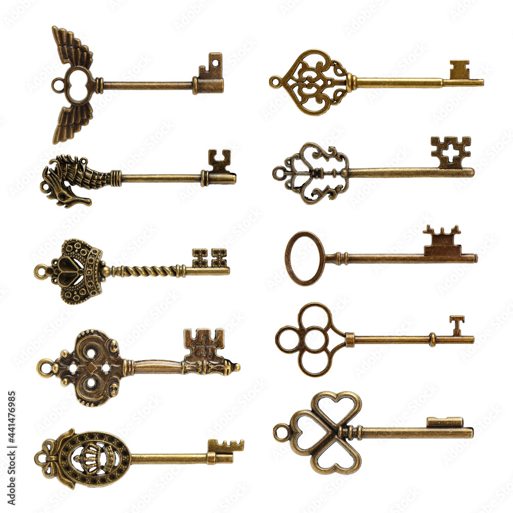 old brass key against a white background old brass key against a white background