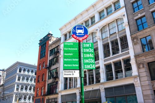 A bus stop sign by Metropolitan Transportation Authority in SoHo neighborhood. No Standing warning - New York, USA - June, 2021 photo