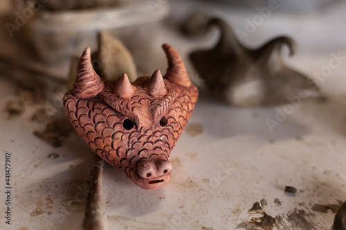 close-up clay flute shaped like a dragon © Amilciar