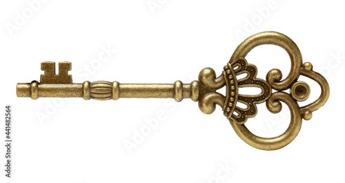 old brass key against a white background