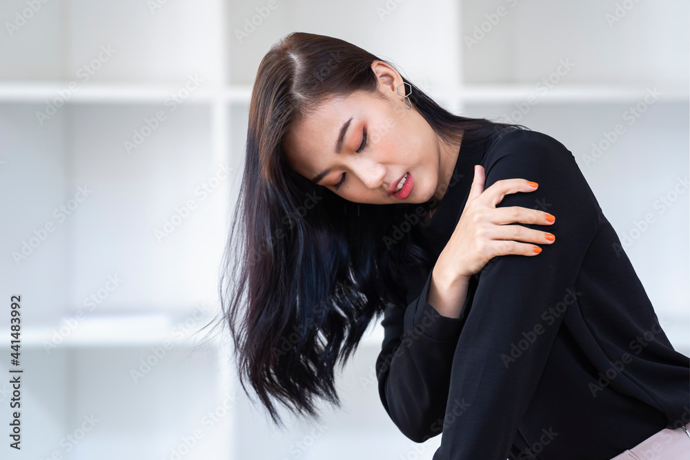 Arms Pain. Beautiful woman suffering from pain in hand at home. injury