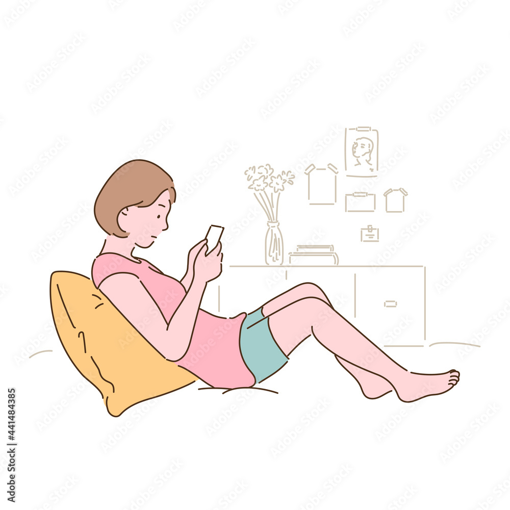 Obraz premium A woman is sitting on her bed and looking at her phone. hand drawn style vector design illustrations. 