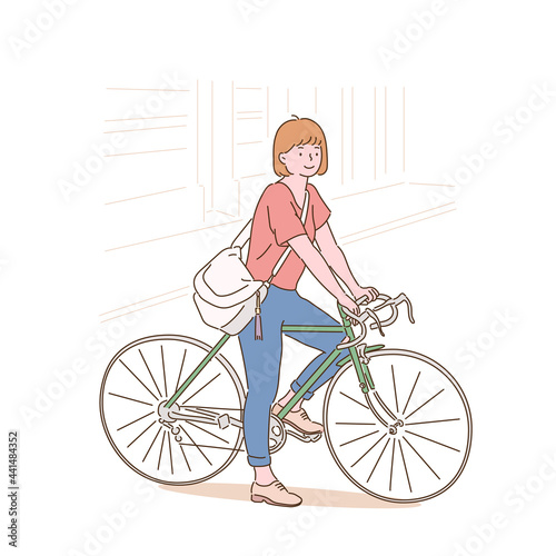 A woman stops for a moment while riding a bicycle. hand drawn style vector design illustrations. 