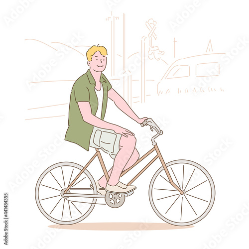 A man is riding a bicycle and smiling. hand drawn style vector design illustrations. 