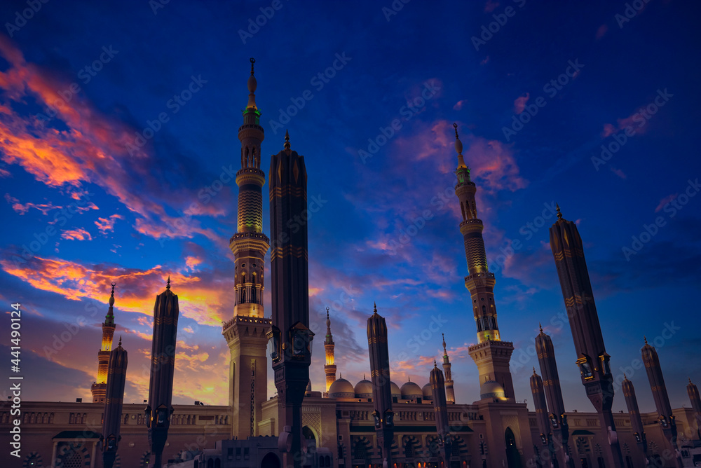 Toned image of a low angle view of Masjid Nabawi (Nabawi Mosque) during sunrise in Madinah, Saudi Arabia. Toned image of a low angle view of Masjid Nabawi (Nabawi Mosque) during sunrise in Madinah, Saudi Arabia.