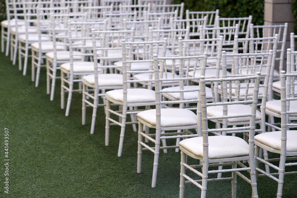 Row of white chairs in party event