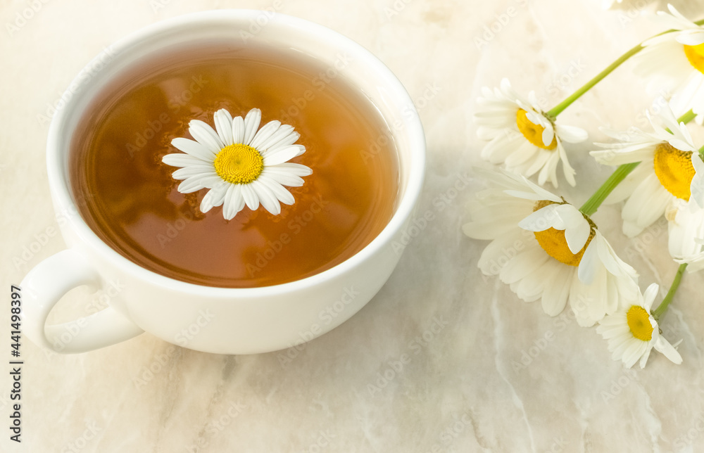 cup of chamomile tea with chamomile flowers. Healthy eating cup of chamomile tea with chamomile flowers. Healthy eating