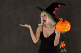 Cheerful woman in Halloween costume having fun
