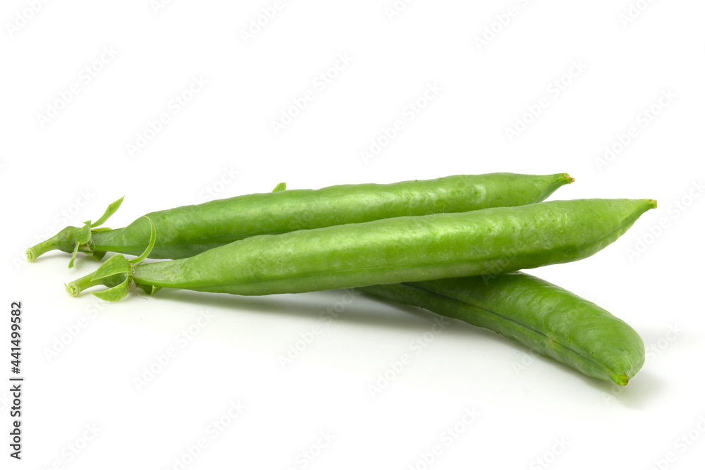 Delicious young peas in a pod isolated on white background. Sweet peas. Delicious young peas in a pod isolated on white background. Sweet peas.