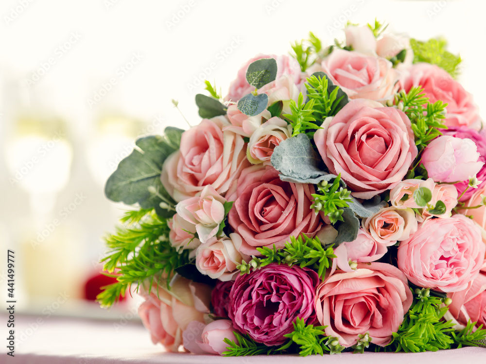 Sweet color rose bouquet with two glasses of wine, love, dating and anniversary concept