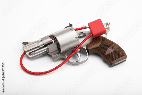 .44 magnum  with Locked disarmed and secured revolver gun on white background photo