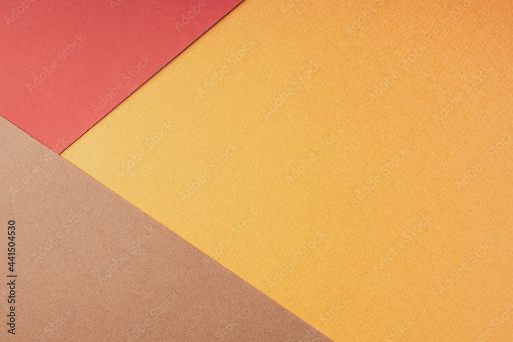 Geometric abstract composition made of colored paper, flat, lay, top view, copy space. Autumn background in warm bright red-brown shades. Creative minimal layout design. Paper texture Geometric abstract composition made of colored paper, flat, lay, top view, copy space. Autumn background in warm bright red-brown shades. Creative minimal layout design. Paper texture