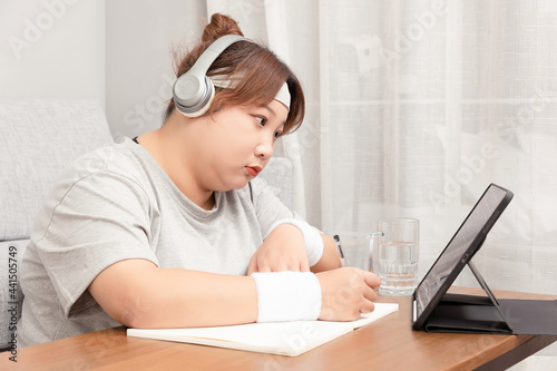 Asian fat girl using tablet