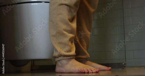 A woman goes to the toilet and sits on the toilet.The process of defecation. Toilet at home. Healthy bowel movements in the morning.