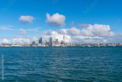 Auckland city skyline beyond Stanley Bay pier and harbour photo