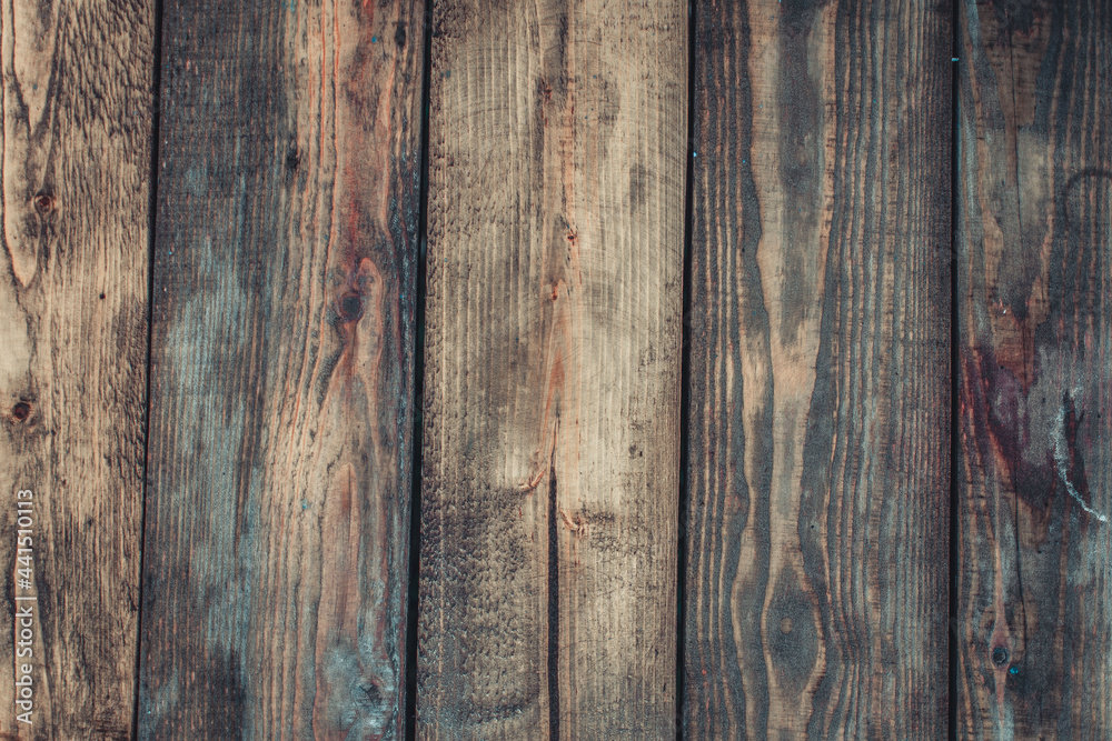 The texture of old worn boards is brown