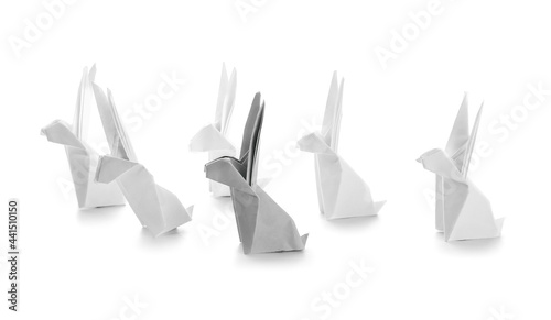 Origami rabbits on white background. Concept of uniqueness