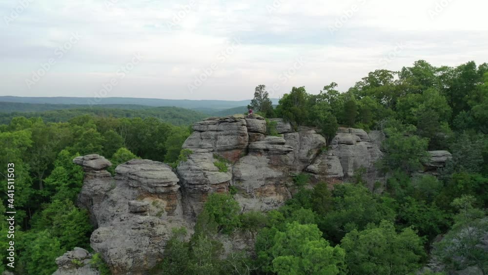 Rocky landscape covered in dense forest in aerial drone view Rocky landscape covered in dense forest in aerial drone view