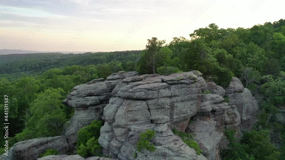 Majestic stone cliff surrounded by vast forest landscape, aerial view Majestic stone cliff surrounded by vast forest landscape, aerial view