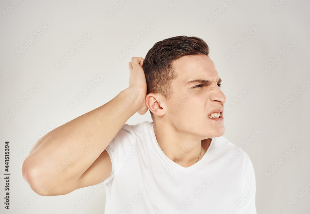 emotional man in white t-shirt emotions studio light background emotional man in white t-shirt emotions studio light background