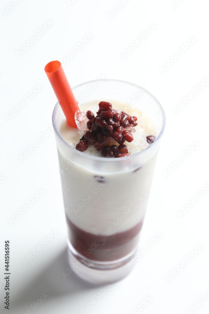 ice cold chilled fresh sweet coconut milk soya drink with red bean paste and red straw beverage menu in white background ice cold chilled fresh sweet coconut milk soya drink with red bean paste and red straw beverage menu in white background