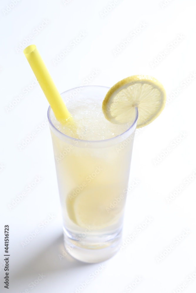 ice cold chilled fresh sour lemon fruit honey drink in glass and yellow straw beverage menu in white background ice cold chilled fresh sour lemon fruit honey drink in glass and yellow straw beverage menu in white background