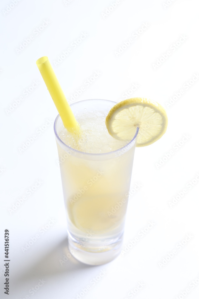ice cold chilled fresh sour lemon fruit honey drink in glass and yellow straw beverage menu in white background ice cold chilled fresh sour lemon fruit honey drink in glass and yellow straw beverage menu in white background